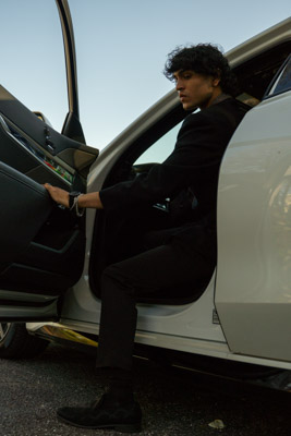 Guy stepping out of car